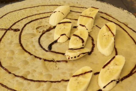 Making  crepe banana chocolate crispy pancakeの写真素材