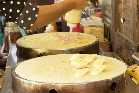 Making  crepe banana chocolate crispy pancakeの写真素材