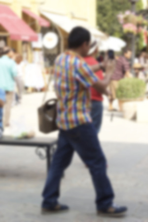 Blurred of people walking in parkの写真素材