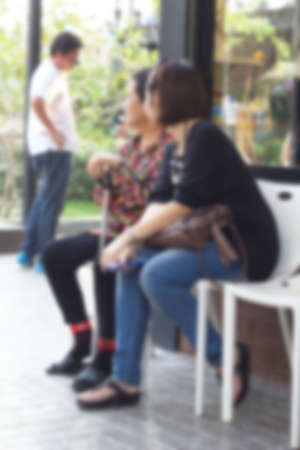 Blurred of people sitting in parkの写真素材