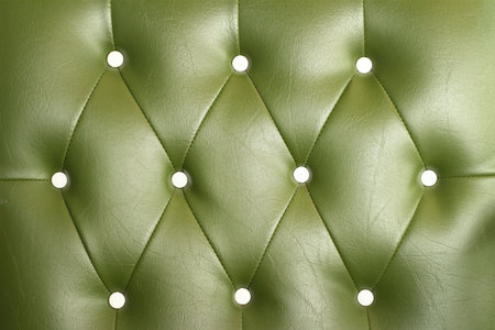 texture of vintage green leather sofa for backgroundの写真素材
