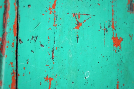 Rusty colored metal with cracked paint backgroundの写真素材