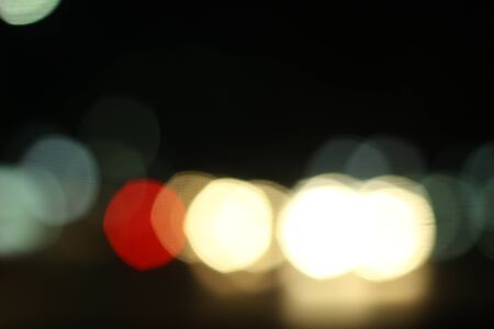 Blurred of car in city at nightの写真素材