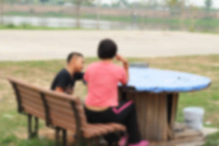 Blurred of people walking in parkの写真素材