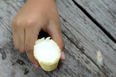 children eating ice cream in hand