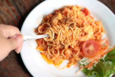 Shrimp spaghetti with sauc on dishの写真素材