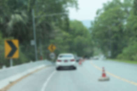 Blurred of car in city at nightの写真素材