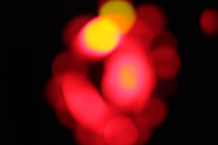 Blurred bokeh of car in city at night.の写真素材