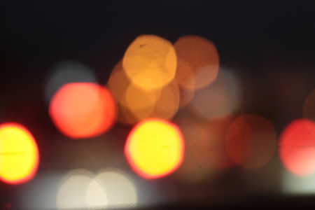 Blurred bokeh of car in city at night.の写真素材