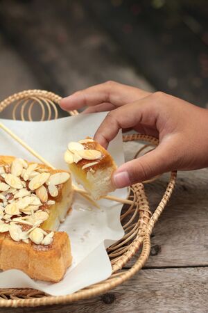 Toast topped with almonds and honey.の写真素材