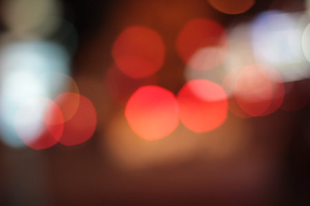 Blurred bokeh of car in city at night