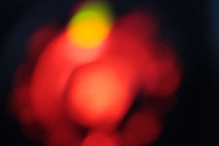 Blurred bokeh of car in city at nightの写真素材