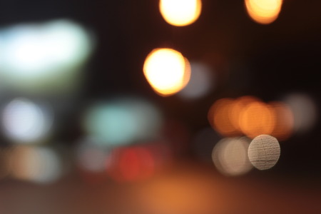Blurred bokeh of car in city at night.の写真素材