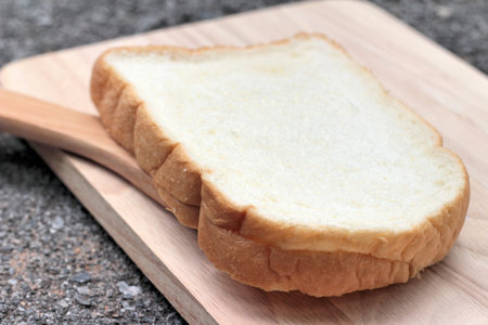 slice of bread on wood background