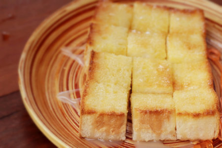 Bread, butter, topped milk with tasty.