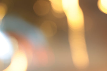 Blurred bokeh of car in city at night.