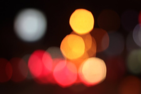 Blurred bokeh of car in city at night.の写真素材