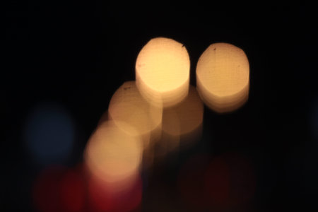 Blurred bokeh of car in city at night
