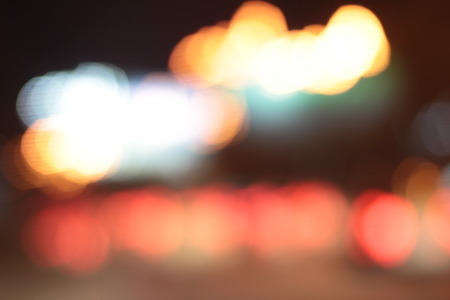 Blurred bokeh of car in city at night.の写真素材