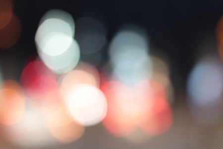 Blurred bokeh of car in city at night.の写真素材