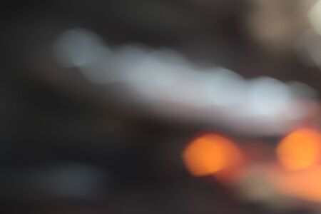 Blurred bokeh of car in city at night.の写真素材