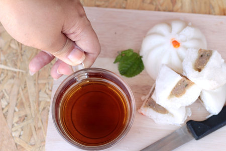 steamed pork buns, chinese dim sum and hot teaの写真素材