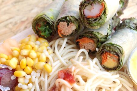 Pasta spaghetti with salad mix fruit and vegetablesの写真素材