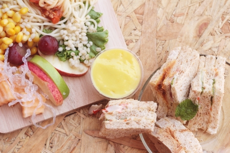 Pasta spaghetti with salad mix fruit and bread sandwich.の写真素材