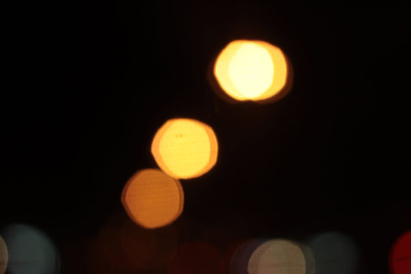 Blurred bokeh of car in city at night