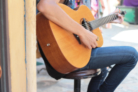blureed men playing the guitarの写真素材