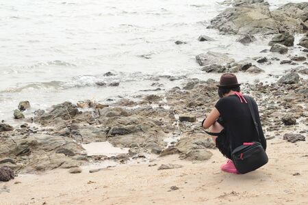 blurred people on the beachの写真素材