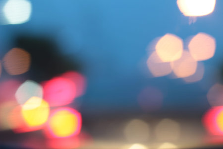 Blurred bokeh of car in city at night