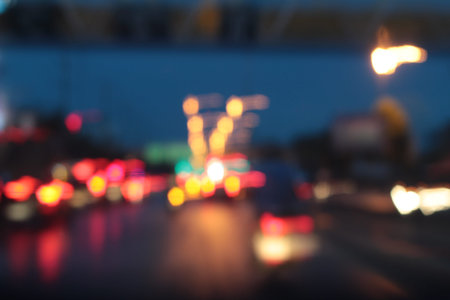 Blurred bokeh of car in city at night