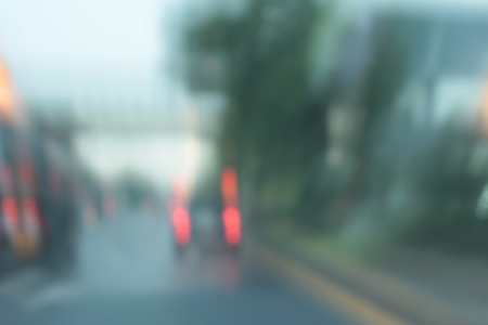 Blurred bokeh of car in city at nightの写真素材