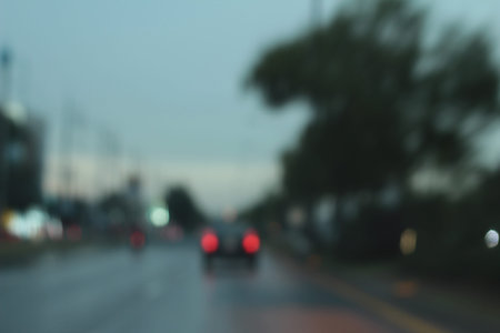 Blurred bokeh of car in city at night