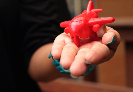 Toy plane with a red propeller.の写真素材