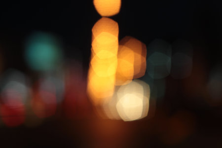 Blurred bokeh of car in city at night