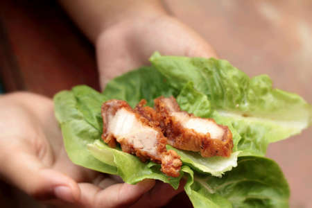 Pork fried with vegetables in handの写真素材