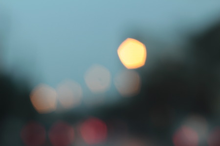 Blurred bokeh of car in city at nightの写真素材
