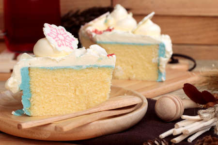 White cream cake delicious on wood backgroundの写真素材