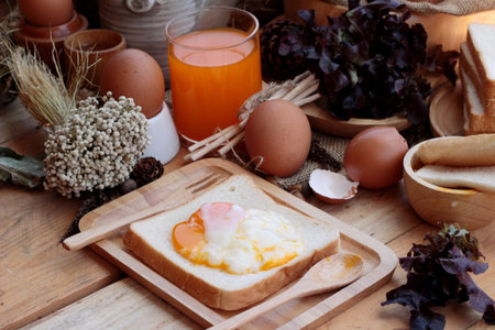 soft-boiled egg with bread on wood background.