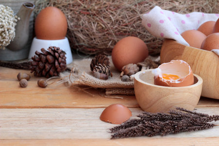 soft-boiled egg and eggs on wood background
