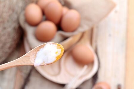 soft-boiled egg and eggs on wood backgroundの写真素材