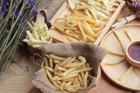 French fries and fresh sliced potatoes with ketchup.