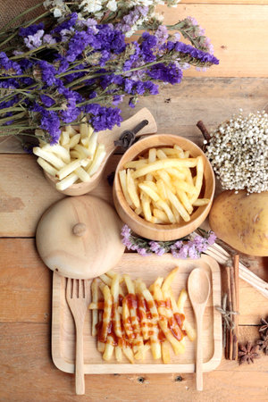 French fries and fresh sliced potatoes with ketchup.