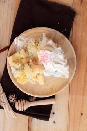 White cream cake delicious on wood backgroundの写真素材