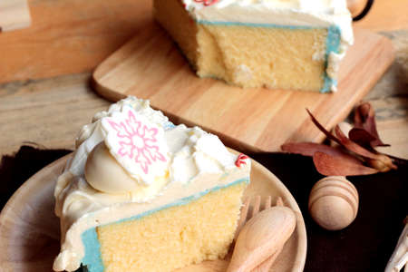 White cream cake delicious on wood backgroundの写真素材