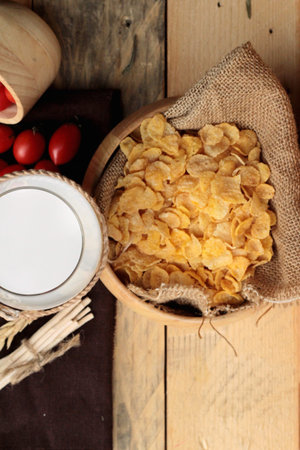 corn flake and milk with fresh cherry tomatoes
