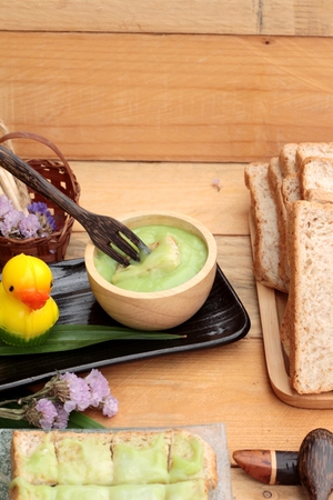 Bread with green custard and fresh milkの写真素材