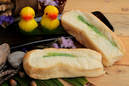 Bread with green custard and fresh milkの写真素材